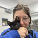 Jenna Plaskon holding a cute black kitten