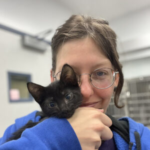 Jenna holding a cute black kitten